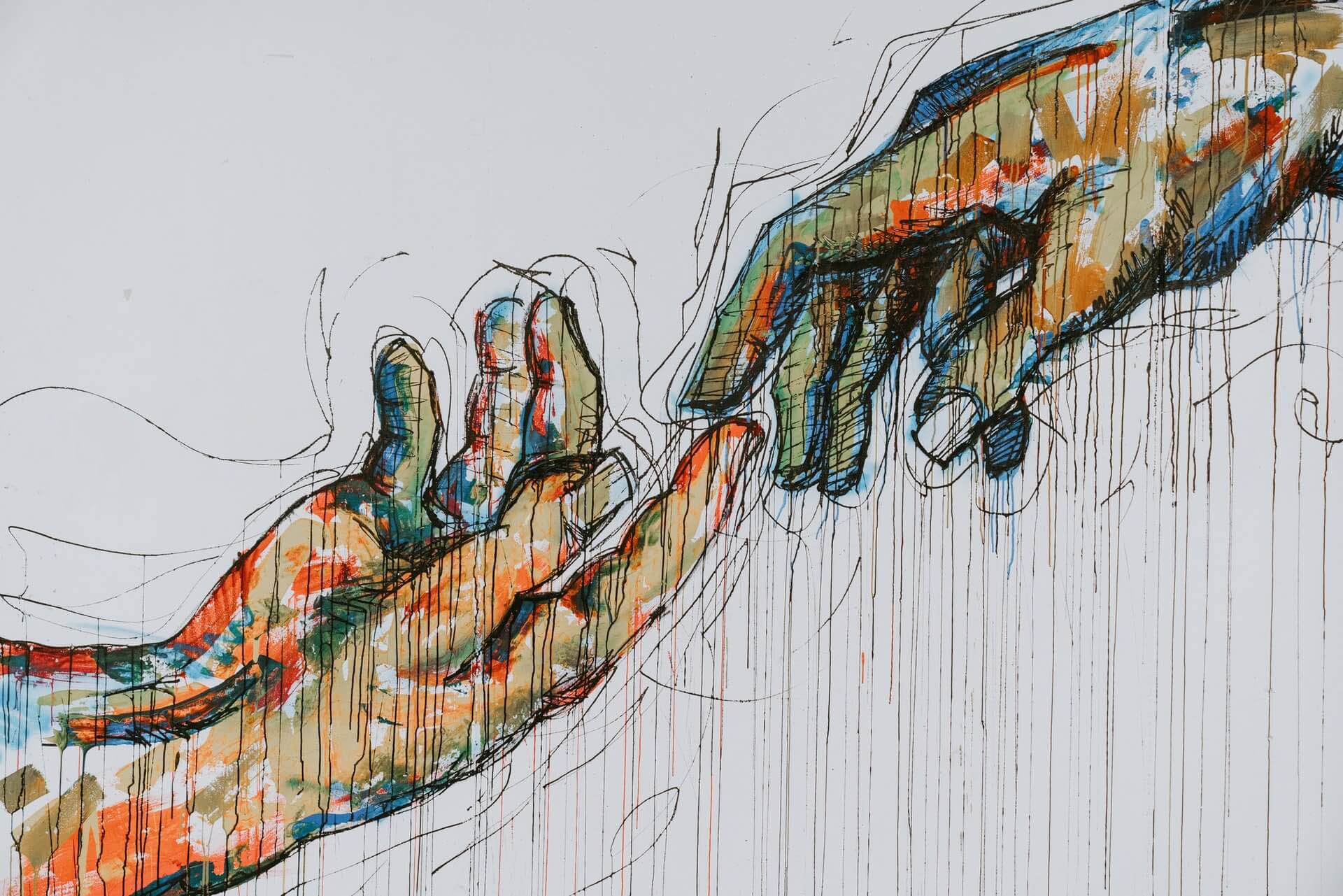 two human hands painting